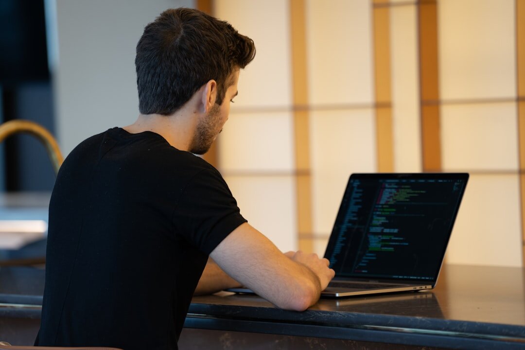developer coding app on laptop